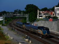 Running for the summer on a primarily overnight and a padded schedule, VIA 604 from Senneterre (the first half of the train) and VIA 600 from Jonquière (the second half of the train) are running early as they approach Turcot Ouest.