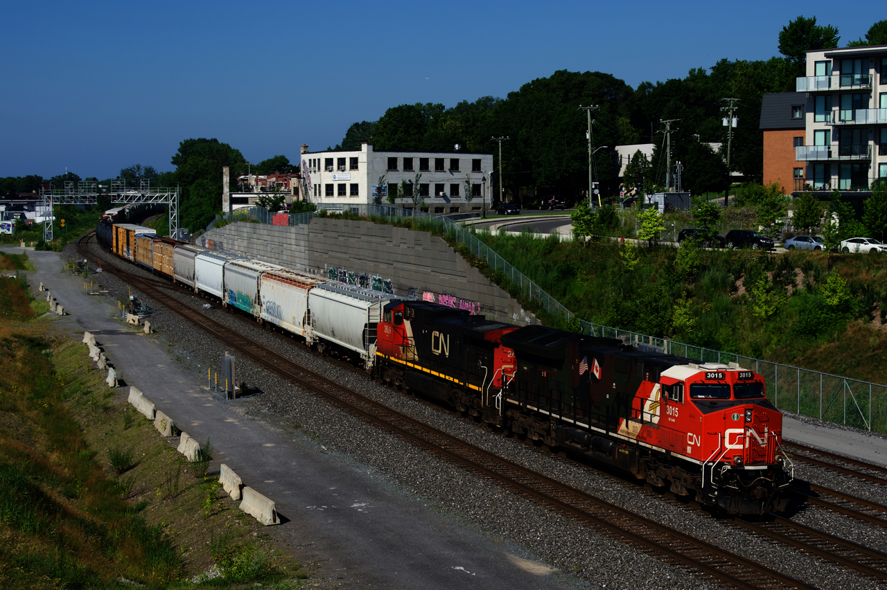 One of CN's two military tribute units is leading CN 310 as it approaches Turcot Ouest, where it will set off cars for CN 400.