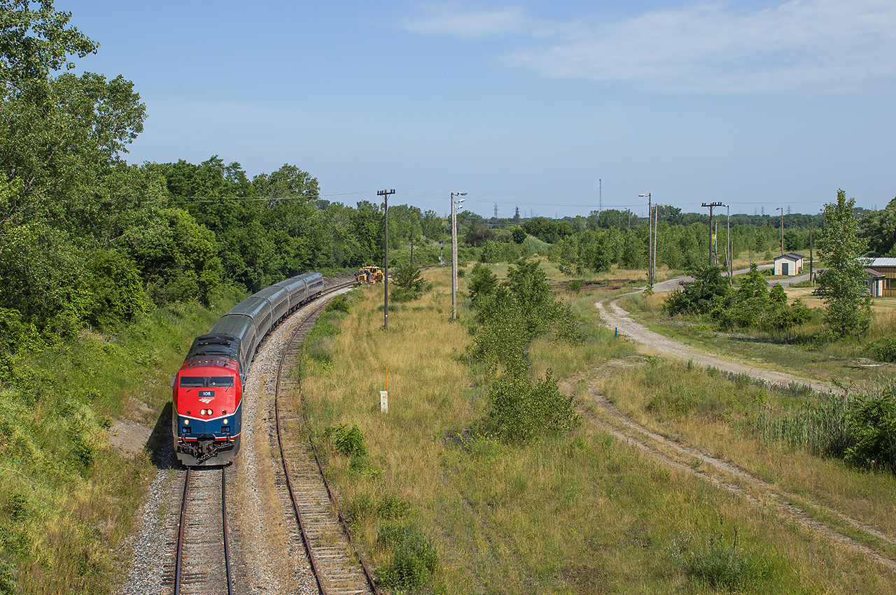 A comparison with Arnold's recent upload, taken roughly 45 years apart, shows the remains of CN's Niagara Falls Yard.  Some stacks of rail, a wind sock, flood light towers, and an overgrown patch of land.  Just a couple days prior to this shot, the Grimsby Sub got a slight increase in activity with the return of Amtrak's Maple Leaf with 50th Anniversary unit 108 leading for the first week or so.Facing the other direction off Victoria Avenue almost 70 years ago, the area was bustling with activity.