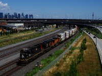 Recently reactivated train CN 123 (Halifax-Chicago) has IC 1028, CN 2678 & BNSF 4314 for power as it passes the skyline of downtown Montreal. IC SD70s are no longer seen at all in Eastern Canada (I last shot one leading in 2017), so this was quite a surprising leader.