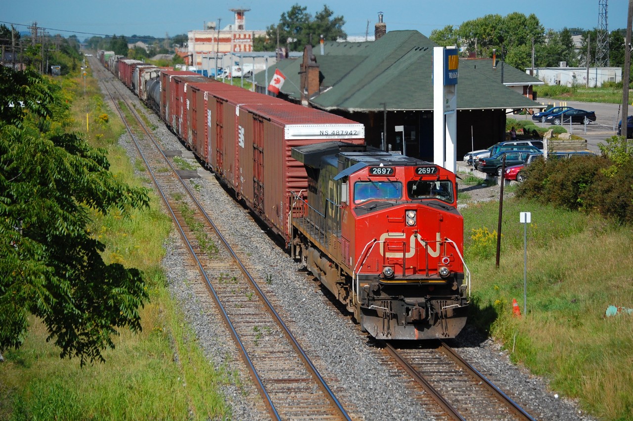 View of CN 421 with CN Dash 9-44CWL 2697 through St. Catharines on the north track of the CN Grimsby Sub.