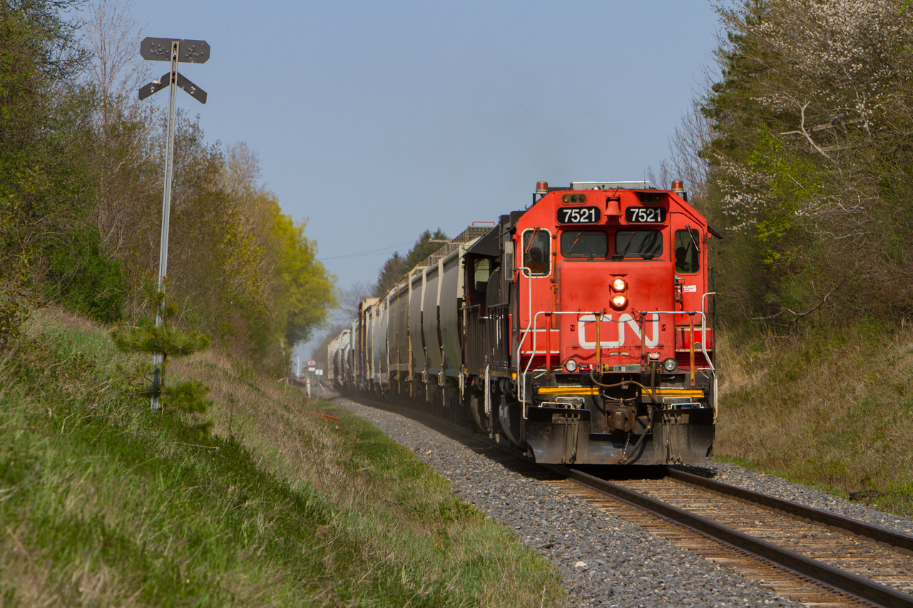 On a warm spring afternoon, 540 is near Guelph Sub track speed on its return trip back to their home terminal of Kitchener. 7521 is in charge on this leg of the run, and is one of many former hump yard service units that have kicked their legs out onto the road over the past year and a half. With the GMD-1s sold off or retired, and a handful of GP9RM's being retired as well by the months, CN has resorted to these 7500 series units to take their place, along with the purchase of 20 or so ex GMTX GP38-2s. Many of CNs ex Oakway SD60s, and SD40-2Ws have been given R/C capabilities and are taking on yard service roles at various terminals to substitute for these hitting the open road, although a number of SD40-2Ws have had R/C capability for some time now. Nonetheless, something different for anyone in areas where 4 axle power is utilized.