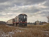 During it's short life span the Guelph Junction Express would operate Santa Trains
in November and December.  Here's the southbound train approaching the crossing at
Carter Road in Arkell.