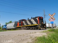 CN made an attempt at using distributed power on some of it's wayfreights, but in the end,
decided it wasn't really necessary.  CN 540 back on the move after switching WestRock.