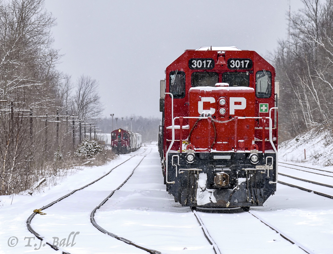 CP CWR train sits on the north service track at Guelph Jct. while the OSR switches off in the distance.