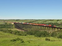 CN 3909 leads an east bound intermodal over the Battle River Trestle