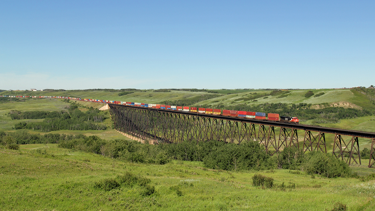 CN 3909 leads an east bound intermodal over the Battle River Trestle