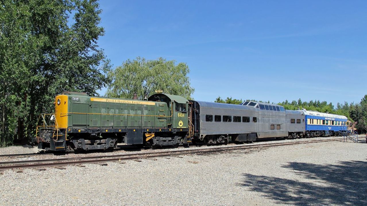 With the tour train out on it's travels we can see what spare equipment is sitting on the back track.  MLW S-3 8454 was originally built for CN in 1952, after retirement in 1963 she saw several industrial/leasing assignments ending her working life with Parrish and Heimbecker before being acquired by the Aspen Crossing Railway.