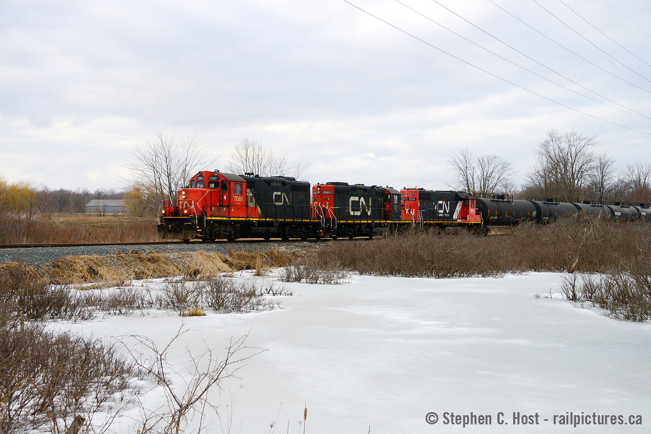 In contrast to my last post Today the Talbot spur is one CN train (each way) per day and runs late in the afternoon except on Sundays when it is a day job. CN 584 is crossing some ponds near Glanworth Ontario with four axle power. Back in the Subdivision days the Talbot used power left behind by CN 435 so it was six axle territory. Four axle power like this from CN was rare. Now that's all you get.