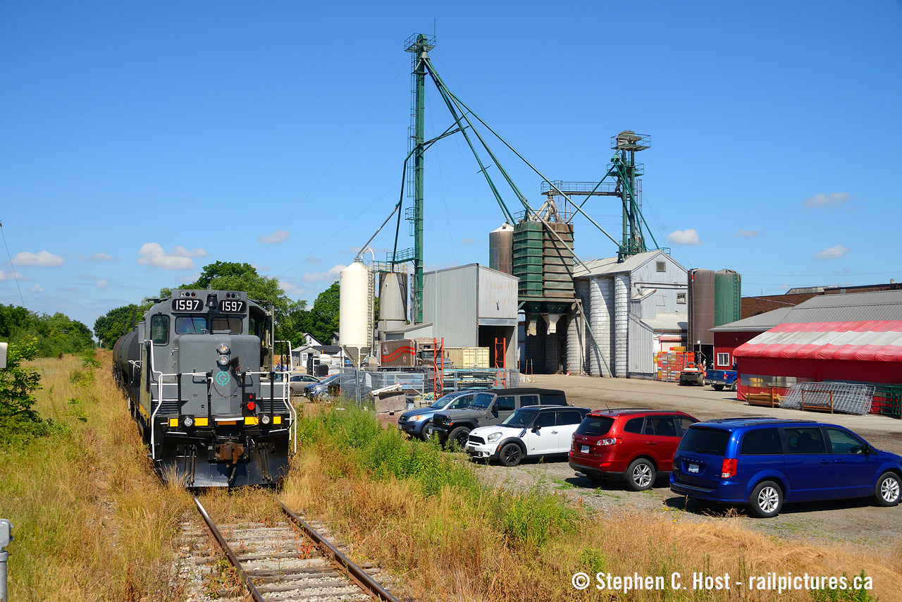 A tale of two railways, but run basically by the same company. Above you'll see the GIO Railways "St. Thomas and Tillsonburg Railway" as I understand it, this is the legal name of the company. The train is in Aylmer and you'll see in the background is Elgin Feeds Country Store/Shur-Grain. There's quite a difference here though as the large concrete silos that were once here are gone. Compare to This picture of the St. Thomas and Eastern with ALCO power as they shuffle  around Aylmer when the silos were up. With GIO Rail purchasing Trillium in 2018, they effectively bought the company that once operated the ST&E. Funny how the name is so similar yet different - wondering why they didn't' just revive the ST&E name as they probably own it now. P.S: For those wondering the Niagara region operations are still the Trillium Railway as a wholly owned subsidiary of GIO Rail Holdings.