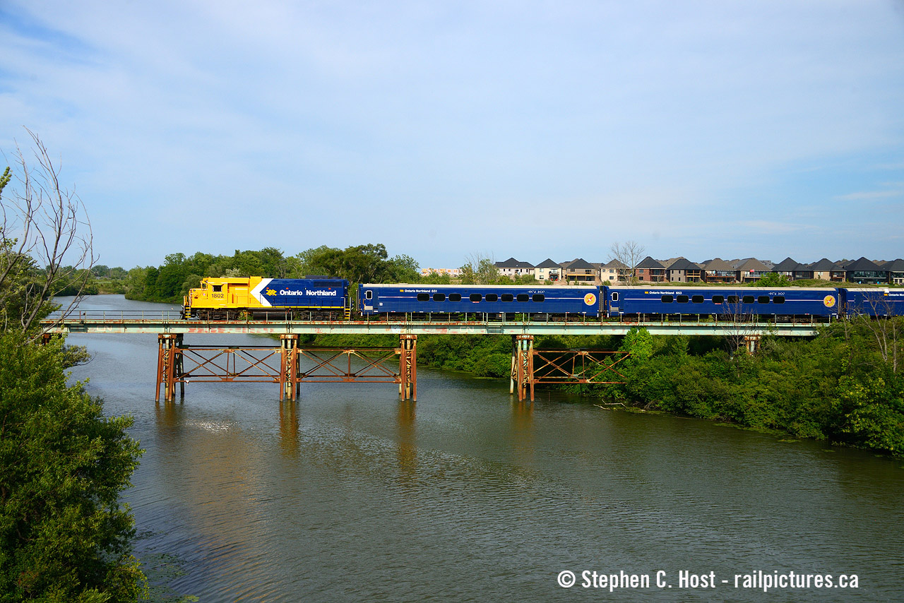 Ever have one of those things that just went your way? I missed the party last week as I was up north in Tobermory camping with my family. We came home a day early and on Saturday afternoon I was relaxing but getting itchy to do something. I knew the train was parked at the Robin Hood elevator in Port Colborne and I checked the weather - crap sunday, back to work for me Monday, but looks nice for this afternoon, so I decided to do it. So I called a buddy of mine who enjoys brew pubs and said I want to go down to the port, get a photo, then we can go eat then go home. I left at 3 PM and went straight there as the light gets good from 4:30 to 5:30 PM, and when I arrived, the train was gone! What the heck, a friend told me it was there only 3 hours previously. I went north to look for them and they were already about to get off the Harbour spur and take the Canal spur, so I had a chase on my hands. I didn't get the Robin Hood photo, but I came home with a dozen shots instead, and a trip to Cold Break Brewing across from the St. Catharines VIA afterwards - no complaints here especially when the sun came out this nicely. This train should be going back north any day now as they, at the time I shot this, were waiting for CN to give them a pilot and a time slot home. Have an eye folks in the GTA and north!
Pictured is the "film shoot train" heading north on the former CNR Canal sub, crossing the former Welland Canal. This part of the line was built around 1972 for the Welland Canal relocation project and much of the line from here to somewhere near Thorold is welded rail.. yet still only 15 MPH due to Rule 105 special instructions.