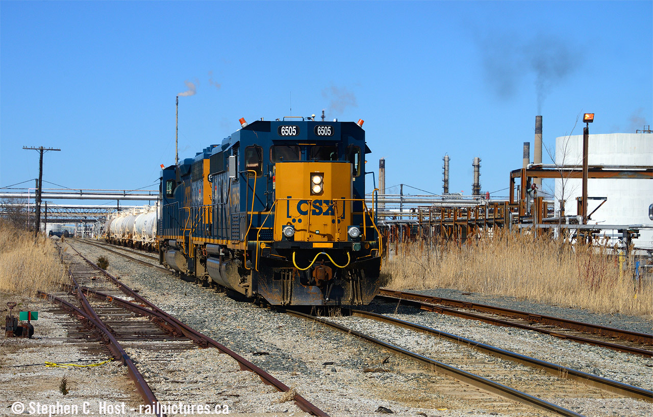 UGH. This place used to be BUSY. A road freight six days a week between Sarnia and Chatham and back. A local five days a week, three days a week Sarnia to Sombra and back, two days a week Chatham to Blenheim back to Sarnia. Four yard jobs daily, two day shift and two night shift.  D718 also ran Detroit to Windsor taxi from Sarnia three days a week. The Chatham road freights ended 2006. The Detroit Windsor (Walkerville) turn ended around 2013. The last train to Dresden was 2013 and the freights to Sombra have slowly been cut back where service is minimal at best today. I don't know when all the yard jobs were cancelled, but all that's left now is a day shift and sometimes a night shift monday-friday with usually one job some weekends. And back in the day there would have been four sets of power - three CSX and one CP (run through) and until even 2021 there were still enough for three sets of power.... now there's only one - what you see here is all they have. Why the UGH? I don't like these things as I think they're UGLY. Only two engines. But none of that matters to the crew, or the company. The reason why these are here? Inspections. These units can go 180 days between inspections as opposed to 92 days for older non computer monitored units. Inspections cost money. That's it. These are overkill for the Sarnia area as these 40's can pull a heck of a lot more cars than they do now. Number of employees today? About 8 to 10 total. That's it. Back in the day, if you do the math, with three (and four) man crews, and recrews, as late as 2006 they were calling about 20 to 26 men a day to work all the trains out of the Sarnia Terminal. Now it's only four on a busy day. It's a surprise CSX remains in Ontario in 2022.