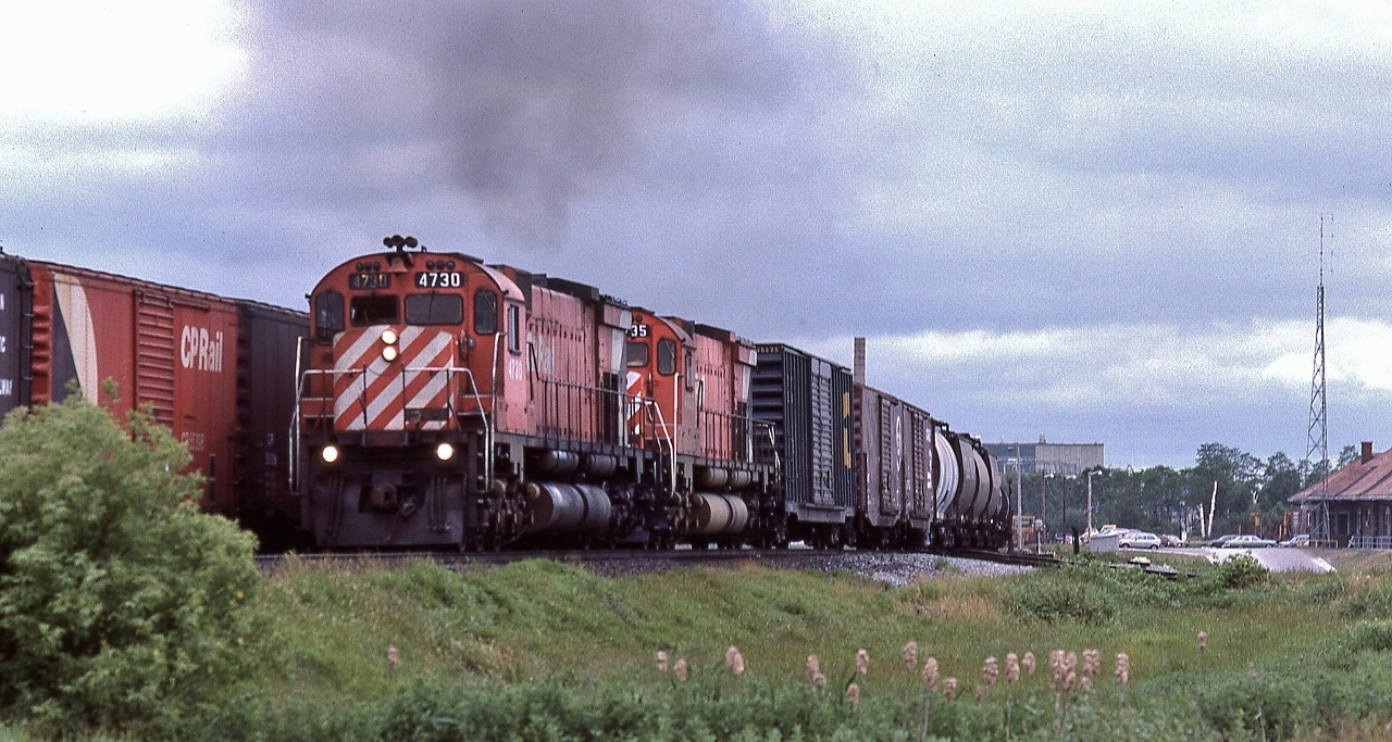 CP Rail 916 blasts through the Cobourg station site,


   a pair of MLW M636's are a very welcome sight on an otherwise slow boring hot and humid Saturday


   at Cobourg, June 23, 1979 Kodachrome by S.Danko


   more Cobourg:


       FPA-4's 


sdfourty