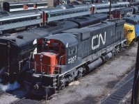 <br>
<br>
   Breaking News – circa April 1977 – the invasion has begun: Seventies Super Power makes Spadina appearance !
<br>
<br>
   Second generation MLW 1970 built M-636  class MF-36a  CN #2307 is in first generation company, identifiable: 
<br>
<br>
    GMD 1958 built FP9A  VIA CN #6540
<br>
<br>
    MLW 1959 built RS-18 CN #3113
<br>
<br>
    Budd 1957 built RDC-1  CN #6120
<br>
<br>
    GMD 1956 built SW1200RS   CN #1246
<br>
<br>
    MLW 1949 built S-2  CN #8139 
<br>
<br>
    At CN Spadina, April 23, 1977 Kodachrome by S.Danko
<br>
<br>
   CN 2307 lived on with:
<br>
<br>
     <a href="http://www.railpictures.ca/?attachment_id=  7879">  new livery  </a>
<br>
<br>


