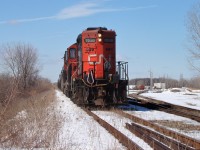 CN 7280 and CN 4784 shove a cut of LPG tanks into storage down the former CASO main alongside Van de Water Yard. This would be one of the last movements along these rails and today a pedestrian walkway passes underneath this spot with only the far right track being active.  