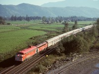 In earlier years, CP operated a rock pit a couple miles west of Agassiz, primarily for rip-rap rock for shoring up eroded banks along the Fraser River.  That is the pit track on the lower right, with No. 1 The Canadian powered by 4068 and 1404 passing by at 0952 PDT on Friday 1978-10-06.  No. 1 was then timetabled 0943 at Agassiz, two miles back, so was wonderfully close to right on time that day.