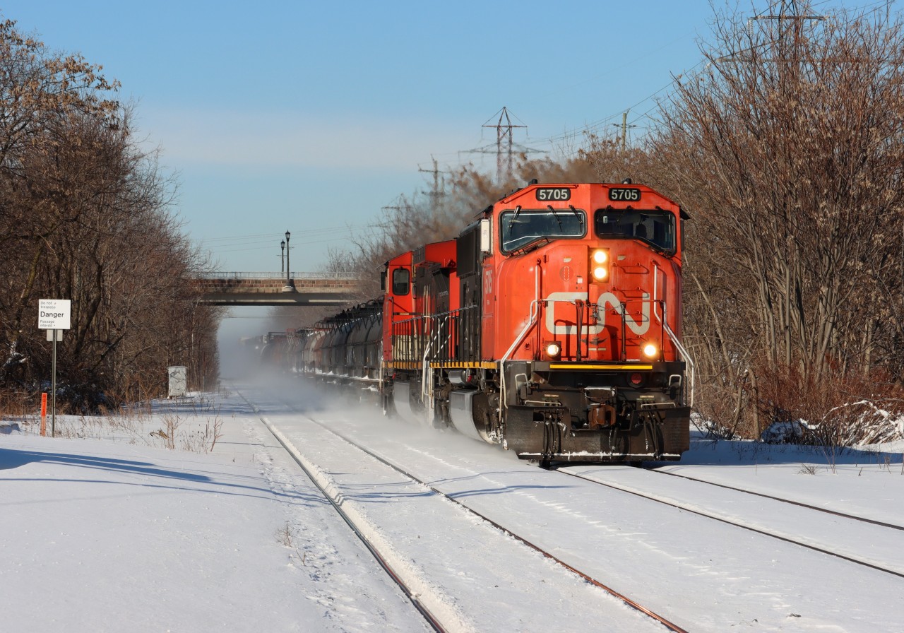On a crisp winter morning, the Grimsby sub's only eastbound manifest train, CN A421, passes by the snow-covered Grimsby station in nice light.