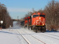 On a crisp winter morning, the Grimsby sub's only eastbound manifest train, CN A421, passes by the snow-covered Grimsby station in nice light.