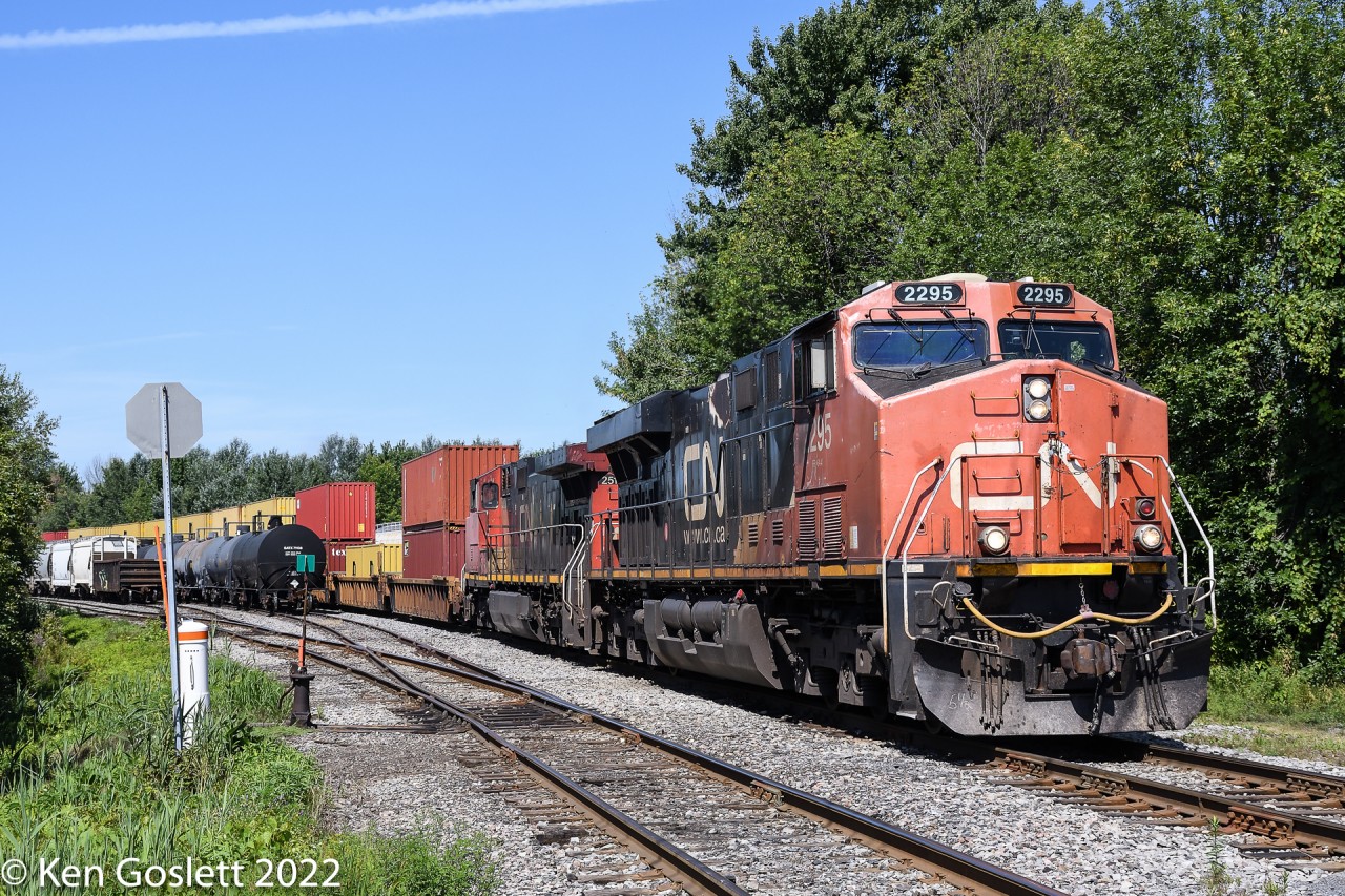 CN 152 passes through the small yard behind Coteau station and onto the Valleyfield subdivision.  The train originated at Deltaport, BC and is travelling to the Valleyfield contianer terminal, built and abandoned by CSX, and now operated by CN.