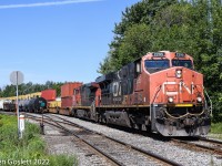 CN 152 passes through the small yard behind Coteau station and onto the Valleyfield subdivision.  The train originated at Deltaport, BC and is travelling to the Valleyfield contianer terminal, built and abandoned by CSX, and now operated by CN.