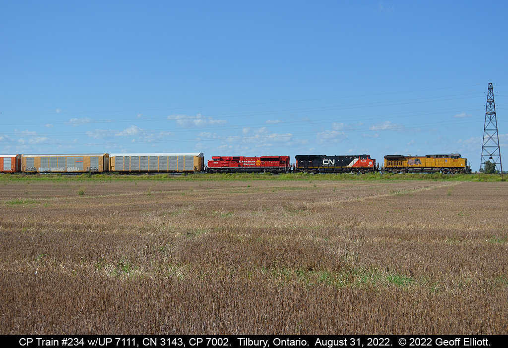 CP Train #234 rolls leisurely across the Essex County flatlands on August 31, 2022.  In charge of 234 today is a very colorful lashup consisting of Union Pacific AC4400CW #7111, CN ET44AC #3143, and CP SD70ACu #7002.  Have to admit that it was worth going out to shoot a little today......