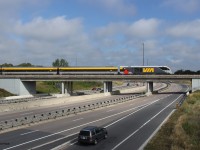 The future look of VIA. The eastbound VIA Siemens trainset led by SIIX 2201 is pictured cruising above the Conestoga Parkway in Kitchener, ON during Montreal-Windsor corridor testing. 