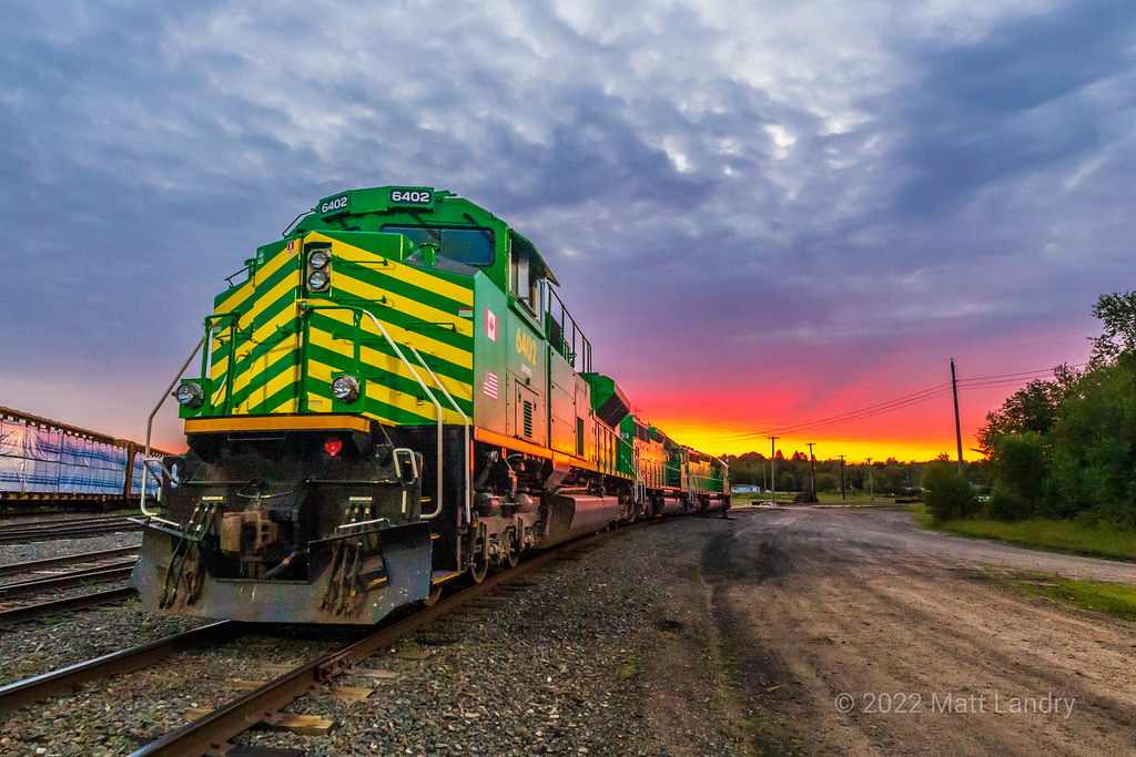 The power for NBSR Train 907-12 sits on the shop pad in McAdam, New Brunswick. Due to various issues the day before, the crew parked the train in McAdam yard and tied the power down at the shop. With a fresh crew, it will continue westbound. I never have this much luck when it comes to sunrise photos, so when this opportunity for a photo op presented itself, I couldn't pass it up.