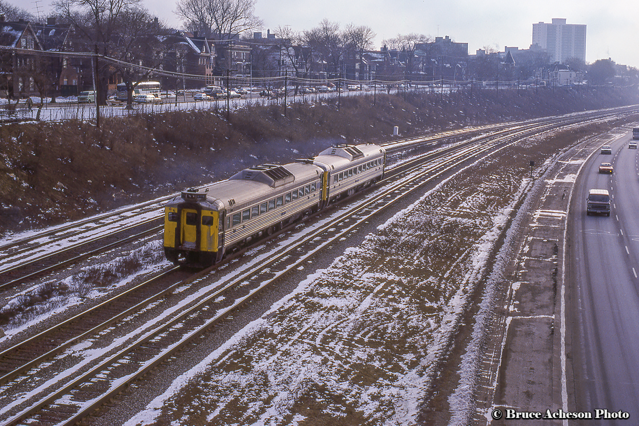VIA 6116 brings up the rear of a pair of Toronto bound Budd RDC's zipping through the Sunnyside neighbourhood of Toronto.