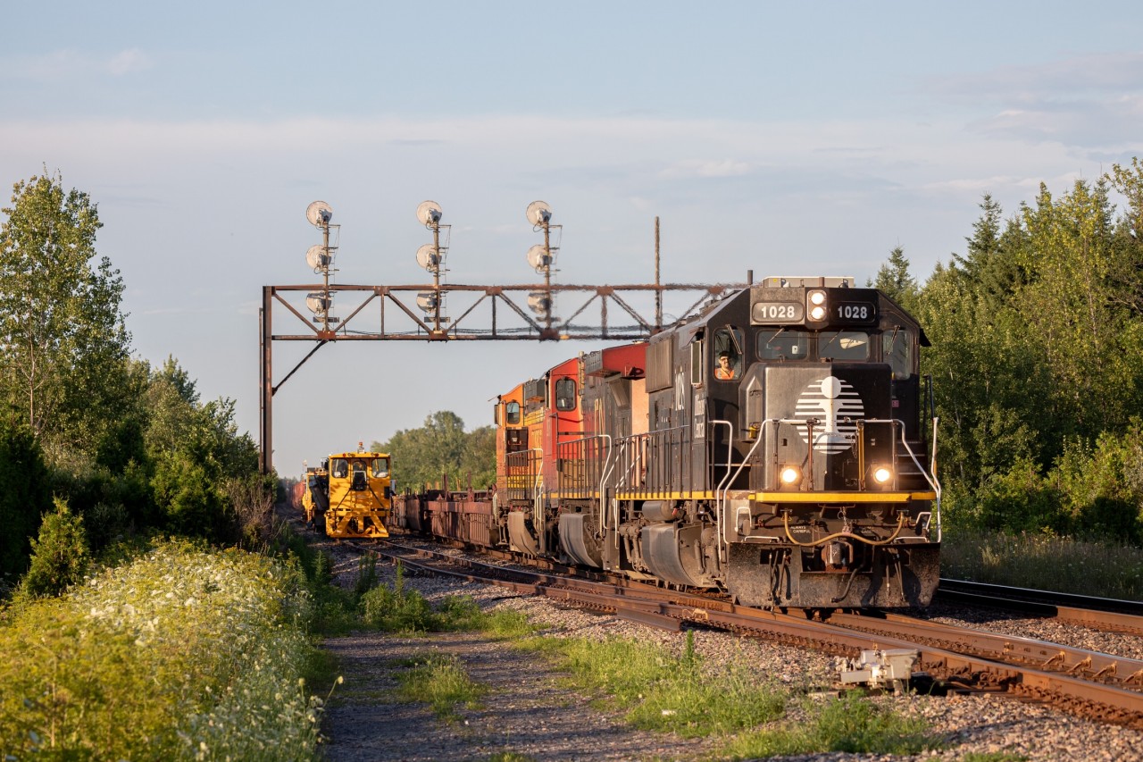 CN 123 passes under a set of searchlights by station name sign “Crysler” on the Kingston Sub. Leading is a rare IC SD70, along with a CN and BNSF Dash 9, which makes for a very colourful lashup.