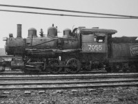 A CN 0-6-0 from the contact prints taken by my Dad. A short look turned up a few facts on these switchers. They were built for Canadian Northern by CLC between the dates of 1912 and 1914 (number series 7031 to 7065 [from CNRHA]). The 7055 is shown retired in Sept. of 1950 (Trainweb.org). This last fact helps to date this picture. As can be seen, the main rods are missing and the 7055 is in a rather run down state. Scrapping must not be be long in the future at the time this photo was taken. Location is unknown.