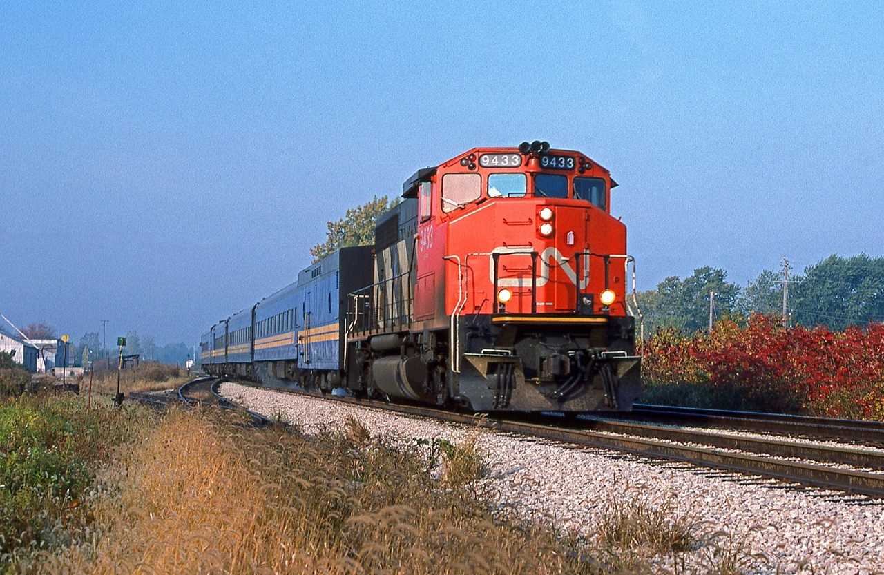 CN 9433 is in charge of VIA's Windsor-Toronto train 72 at Belle River Ontario, mile 90 on the CN's Chatham Sub.