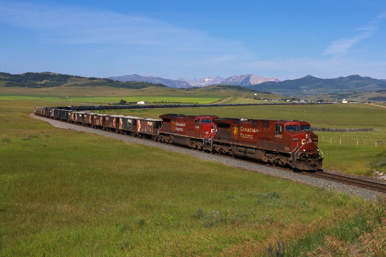 CP 8602 east has conquered Crowsnest Pass and heads east towards Lethbridge with train 318.