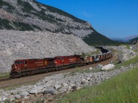 CP 318 rolls past the infamous Frank Slide on a beautiful morning in Crowsnest Pass