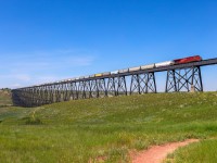 CP 8915 shoves train 319 across the Lethbridge Viaduct