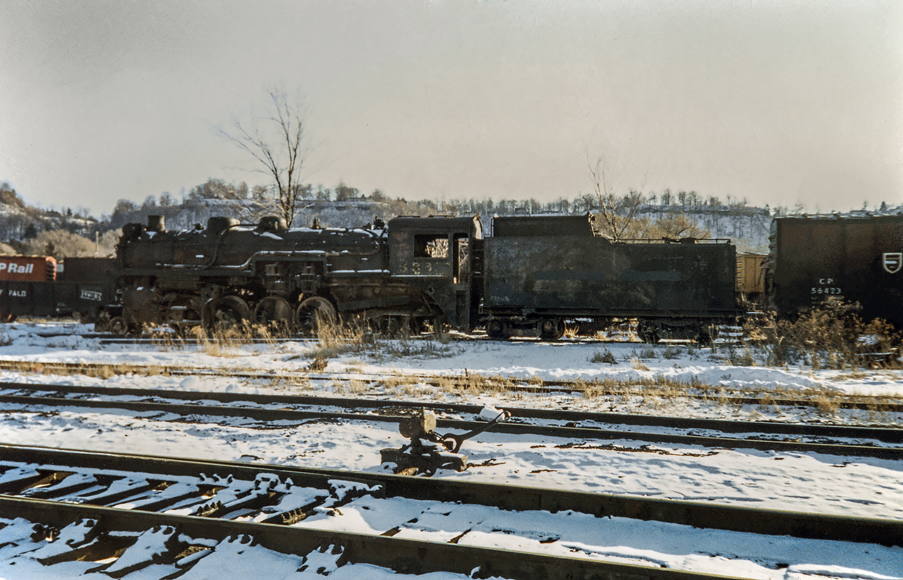 *** Submission possible with restoration help from Jacob Patterson - Thank-you *** - CPR 5361 sitting in the TH&B Aberdeen yard in Feb 1987.  There was a great assortment of old equipment in the out of service tracks in the yard at the time.  Not so long after this photo was taken the 1926 MIKADO was moved on rails to Depew, New York (WNY Buffalo area) for a private collector and restoration.  There was a lot of chatter in 2018 about scrapping the old CLC loco unless a buyer could be found with 100K USD but whether or not it was scrapped is unknown to me.