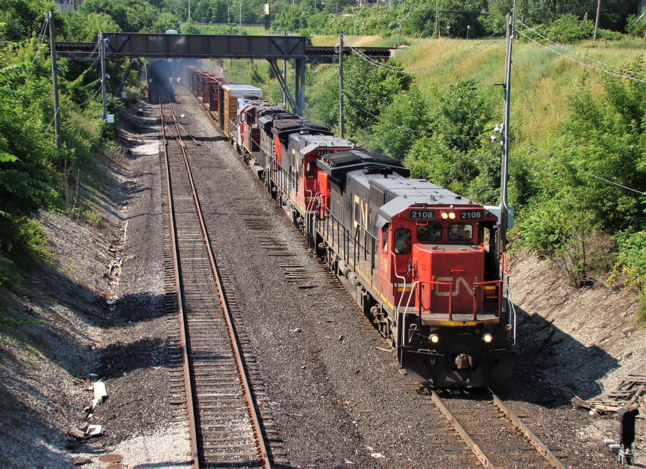 Due to the Paul M. Tellier Tunnel being down in Sarnia because of a derailment, CN rerouted many trains through the Detroit River Tunnel in Windsor. Here we see CN X328 emerging from the tunnel behind CN 2108, CN 2116, CN 8802 and GT 4919. There were a group of railfans waiting for this train, and I remember getting a nasty sunburn as we waited for it.