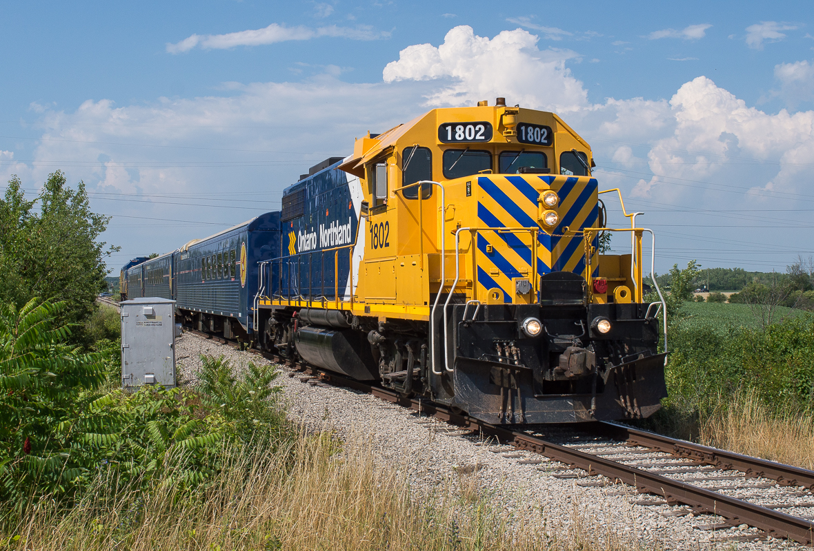 ONT 1802 leads the "Movie Train" down the Trillium between Thorold and Welland.  The trainset took part in the filming of The Handmaids Tale.
