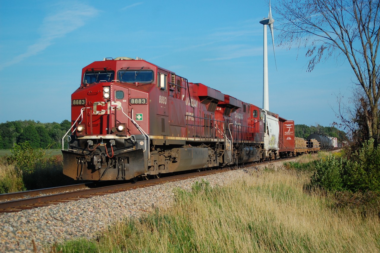 CP Northbound 239 with CP ES44AC 8883 and ES44AC 8844 at Boyle Rd. on the CP Hamilton Sub on Aug 28/22.