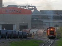The often illusive SW900, Evraz #11 emerges from the roll shop with some freshly loaded coil cars on a hazy May evening.  Recent news states that the Russian based steel company (Evraz) has decided to sell off it's North American subsidiaries including this Regina location.  Evraz has owned the mill since 2008, before which it was owned and operated by IPSCO since the late 1950's. At one point the IPSCO was the largest employer in the city of Regina. It will be interesting to see what the future holds for Western Canada's largest steel mill. 