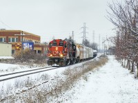 Their work in the north industrial park completed, a pair of vintage GP9s trundle south on the former CN Fergus Subdivision in what could be a scene from a few decades ago.