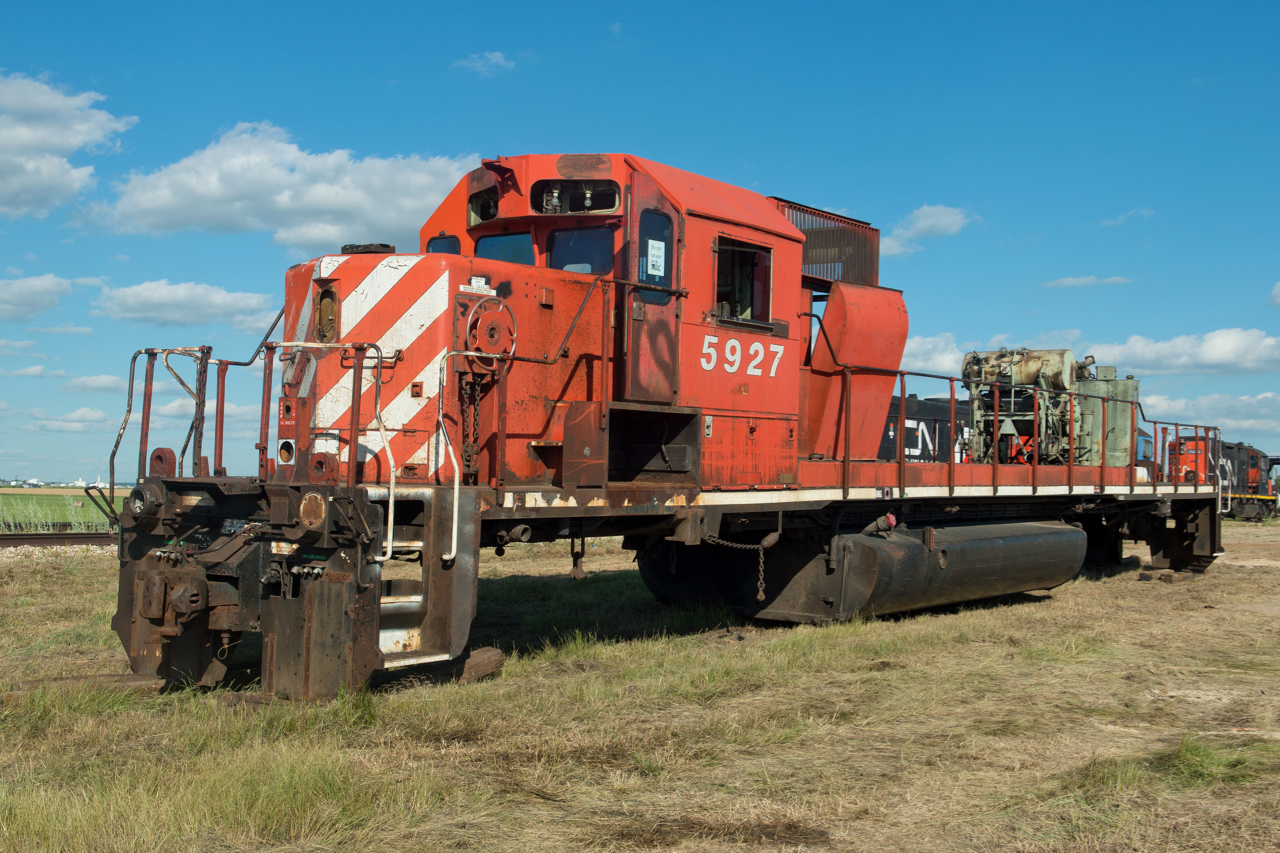 The skeletal remains of CP 5927 sit on the ground next to the Stewart Southern Railway in Richardson Saskatchewan.