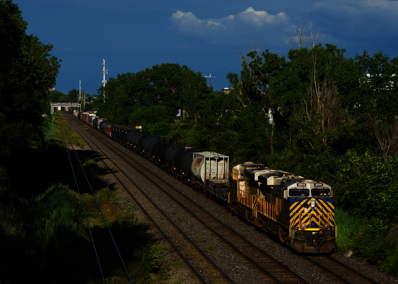 In a not uncommon occurrence for this train, CN 321 has a pair of ex-CREX units (CN 3921 & CN 3914) as it slowly approaches a stop signal at Ballantyne, with VIA 669 ahead of it making its station stop at Dorval on the South Track.