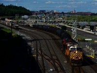 CN 321 has an ex-CREX leader as it crosses over from the South Track to the North Track at Turcot Ouest.