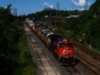 CN 120 has a pair of ex-CREX units and a pair of geeps trailing as it exits Taschereau Yard. Full consist is CN 3123, CN 3951, CN 3958, CN 4711 & CN 4139.