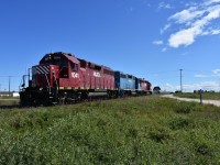 It's high noon in Churchill, MB and the yard crew has been drilling the yard with a variety of flats and boxcars, carrying all sorts of payloads to be offloaded at an open track beside a roadway, or one of the vehicle/equipment ramps off to the right. They are getting in position here to run around a cut of cars placed on the lead to the grain elevator dump building so a load of nice shiny pickup trucks can be spotted at one of the unloading ramps. VIA #693 with a Park car which had arrived on time at 09:00 earlier in the day sits idle in the background in front of the beautiful Churchill station. I had snapped HLCX 1041, LLPX 2605, & HLCX 1046 a few days before on August 1st in Thompson, MB while riding VIA 693 (departed Winnipeg July 31st) on my way to Churchill. Endless scenery and action to be had here!