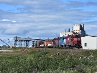 The HBR wayfreight from Gillam had arrived in Churchill earlier in the morning with this trio of locomotives and a dozen or so cars. After a crew change, the power went to work as the HBR yard engine sorting the various cars and spotting them at several different locations in the yard. HLCX 1046, the trailing unit of the three is seen here revering into the yard across from the Churchill station after having run around the loaded cars so they could spot the flat loaded with pickup trucks at an unloading ramp. The locomotive lash-up consisted of HLCX 1046, LLPX 2605, and HLCX 1041. While there hasn't been a loaded grain train over these rails leading to the massive grain storage and loading facility on Hudson Bay since 2015-2016, the very active yard crew keeps the old 85 lb. bolted steel polished with lots of carloads of construction material, vehicles, supplies, and who knows what else being marshalled along the once bustling grain dumper lead.