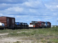 Fresh in from Gillam, MB the HBRY wayfreight has changed crews and begins the busy job of sorting the various loads and spotting them in the yard for unloading. Ex-CN 79858 van is tucked in next to the power and right next to a couple of containers tagged with DOT Placard 1863 Fuel, Aviation, Turbine Engine. It looks like five lucky folks will be claiming their brand new pickup trucks in a few short hours. Other loads ranged from a United Rentals JCB 510-56 Telehandler, a flatcar loaded with pre-formed rebar rods, and several boxcars with unknown cargo. Several of the boxcars were ex-CN double-deck auto tranporters with 9' end doors. (I'll attempt to post a shot of these soon.) Another interesting day of photography in and around Churchill. ????

