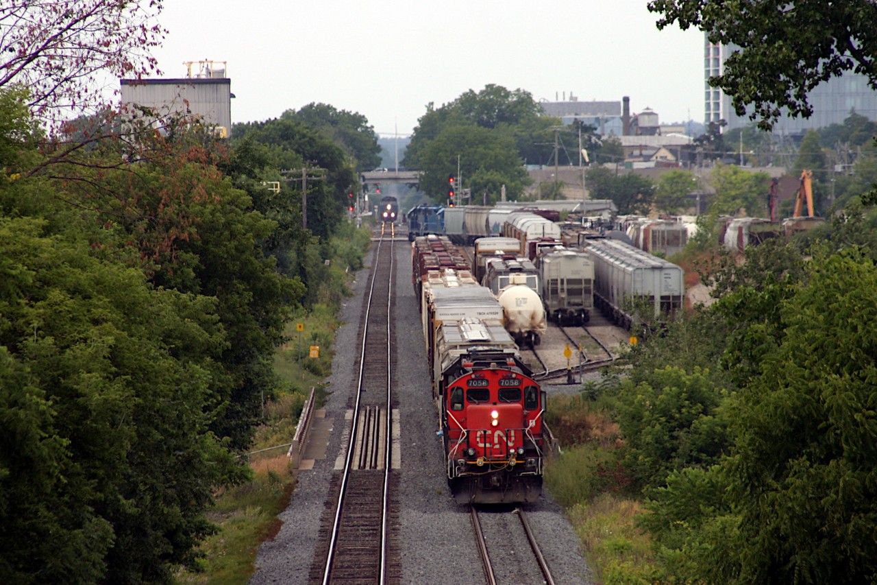I came down to the pedestrian crossing over the Guelph sub just east of Lancaster St. yard to get a shot of VIA 84 from above and noticed 2 trains working the small yard.