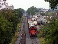  I came down to the pedestrian crossing over the Guelph sub just east of Lancaster St. yard to get a shot of VIA 84 from above and noticed 2 trains working the small yard.