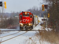 On a crisp December day, GTW 6226 and CN 4028 kick up some snow as they roll through the small town of Baden. One can spot a dimensional load on the tail end bound for GEXR in Goderich and then to Bruce Power if I'm not mistaken. Corrections on that are welcome.